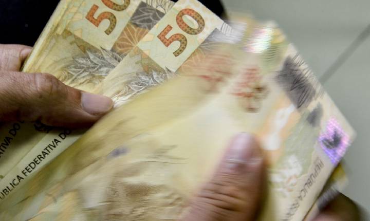 Caixa começa a pagar Bolsa Família de maio